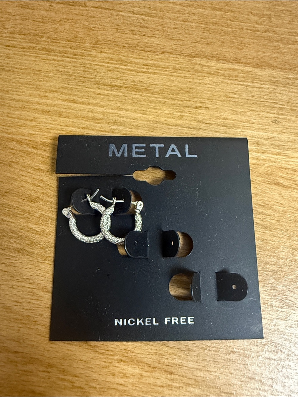 Small nickel free metal crushed look silver tone hoops
